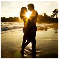 Couple Silhouetted on Beach